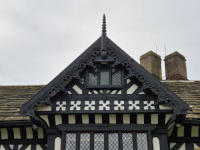 Gable above the entrance to Speke Hall A gable on a Tudor house