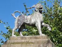 Lion statue at Dunham Massey Statue of a heraldic lion
