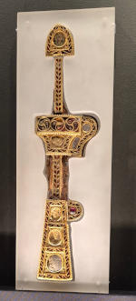 I wish I could remember what this is! A narrow gold object with inlaid garnets